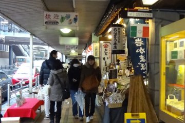 There is also a blue sign on the street in front of the shop that you can look for.