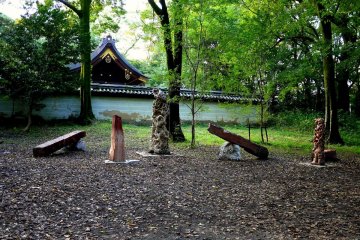 <p>A display of strange sculpture under the trees</p>