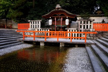 <p>Expanse of water in front of a small shrine<br />
&nbsp;</p>