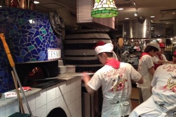 Staff hard at work cooking the perfect pizza