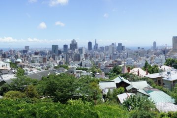 <p>Unfortunately most visitors miss this view. Although the climb up to the shrine itself can be a bit tiring, please keep on going; on the backside of Kitano Tenman Shrine is an observation deck from where you can get this panoramic view of the city of Kobe. The shrine is in the bottom right corner of this picture.</p>