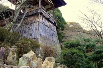 <p>Large rocks at the base of a tower</p>