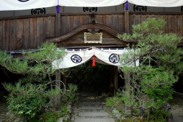 <p>Curtained path under a temple corridor</p>