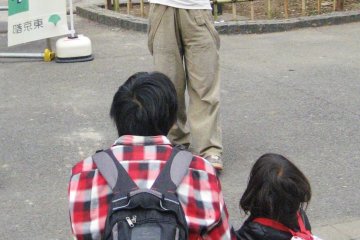 Young and old are entranced by a juggler