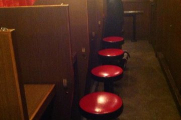 Individual stalls--kind of like a prison viewing room?