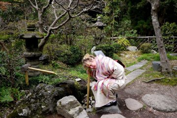 <p>Listening to "water music" through a bamboo pipe</p>