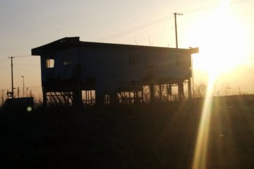 <p>The entire first floor was taken out, but the structure still mysteriously&nbsp;endures during the sunset.&nbsp;</p>