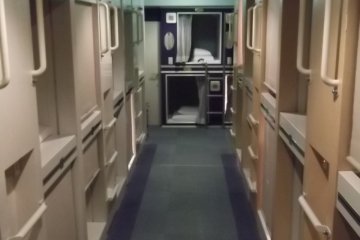 <p>The room with the capsules is separate from the bunks and other facilities</p>