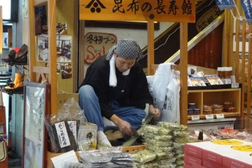 In front of one shop you might find a man demonstrating how they make slices of dried, shaved seaweed.