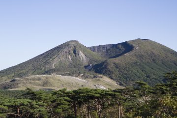 <p>Looking over the Japanese red pines to Mt. Io and the asymmetrical crater of Mt. Karakuni</p>