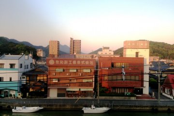 <p>The larger rooms, ending in numbers 1 to 6, have a view of the canal and the distant mountains. This is the view from room 401 at&nbsp;Hotel Yoshida Maizuru</p>