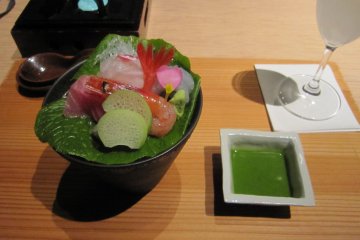 <p>Sashimi and Soy sauce with field mustard. It was mild and mellow and fit the coming spring season</p>