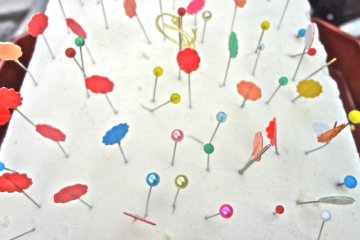 Different from the brushes however, the needles are not burned but are collected and pinned into a large cake of tofu.