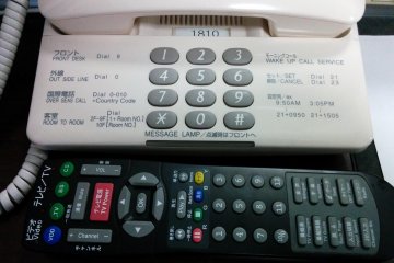 <p>A side-by-side of the remote and phone. Look closely: English and Japanese are written down to the detail!!&nbsp;</p>