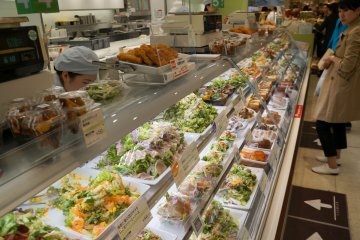 <p>The "artwork" in a depachika extends to the salads as well. All of the salads are extremely fresh and very creative. They are sold by the 100g. Try to go to a food basement on an empty stomach if possible. You'll want to walk around and snack or eat your lunch there if you can</p>