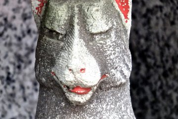 <p>Many of the fox statues have lost their sharp ears; this one now looks likes a llama</p>