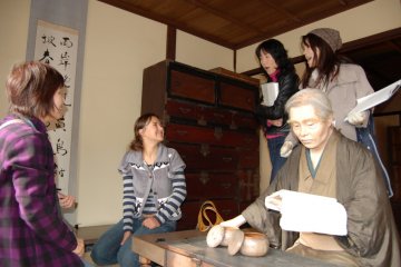 The founder takes a moment to greet a foreign guest