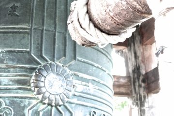 <p>The temple bell is in a corner of the temple grounds, down nearer the exit</p>