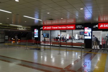 Down the escalator and you will find the JR East Travel Service Center