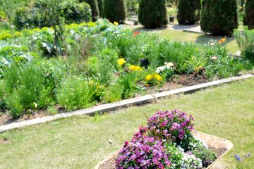 <p>The garden slopes gently downward, and small mountains make a lovely backdrop.</p>