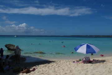 <p>Lounging on the pristine white sand.</p>