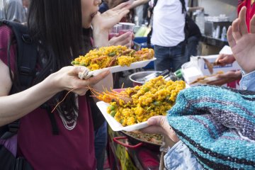 Stall serving up delicious plates of Spanish paella.