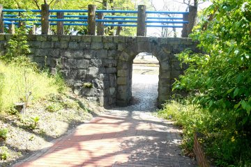 <p>This stone bridge was reconstructed to resemble the original bridge German POW made. The original bridge is still preserved in the Oasahiko Shrine grounds in the area. When they were living in the camp, they visited the shrine, and to commemorate the visit constructed and donated the so-called, 'Spectacles Bridge' to the shrine.</p>