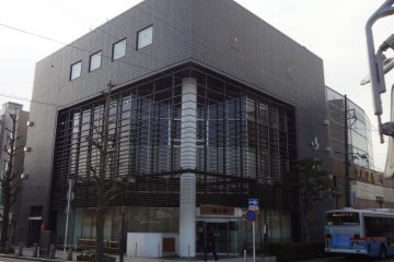 Kimi is located in this charcoal grey building just across from the station