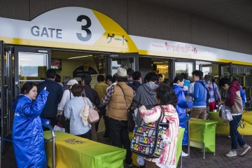 <p>Baseball fans queuing to get in.</p>