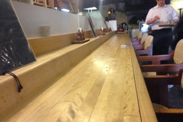 <p>The counter is a great place to catch up with the chef, and it looks a mile long when you had a few too many drinks and wanting a place to rest your head.</p>