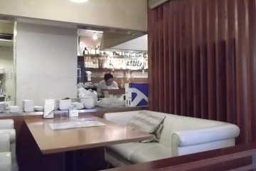 <p>One of the couches in front of the open kitchen</p>
