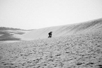 <p>A couple making their way up slowly, almost like a pilgrimage to the submit.</p>