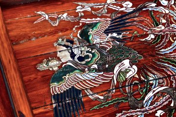 <p>Flying goddess is carrying a plate of cut fruits in her hand</p>