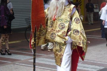 <p>This is Sarutahiko Okami, a deity of the Shinto religion and a symbol of strength and guidance. He is wearing traditional Japanese wooden sandals called geta.</p>