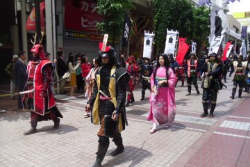 <p>In the red armor with the impressive horns is Sanada Yukimura. He fought on the opposing side to Date Masamune at the Siege of Osaka.</p>