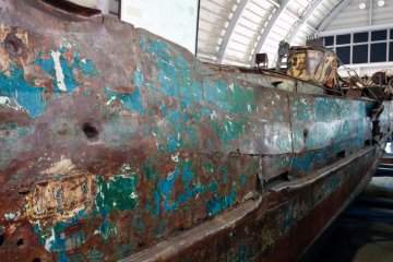 <p>A side view of the ship. With so many bumps and bruises, it probably sunk relatively quick.</p>