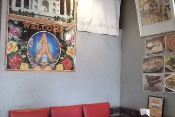 <p>There are colorful prints and posters all around</p>
