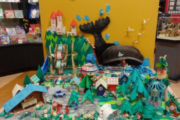 <p>The amusement park with castle, Ferris wheel, merry go round, even a large whale, and completed with happy children.</p>