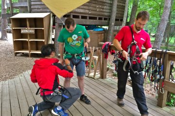 First stop, Safety Harness Station. Ask questions if you're at all feeling uncertain at this point because once you're all secured, you're moving onto the practice obstacle.