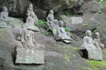 <p>Temple statues along the path</p>