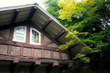<p>The main building is Tudor Gothic style</p>