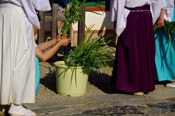<p>Shinto priests preparing for a ceremony</p>