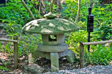 <p>Just one example of several impressive traditional stone monuments found within the garden grounds</p>
