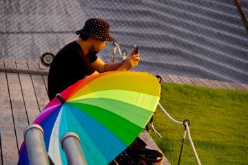 <p>Rainbow color umbrella and sunset hunter</p>