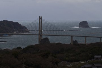 <p>Stormy view of the big bridge to Kabe Island, with Taka Island on the right</p>