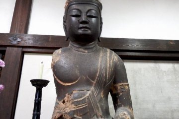 <p>Wooden statue of Dainichi-Nyorai (Vairocana) made during the late Heian Period (794 - 1185) in the entrance hall of the temple</p>