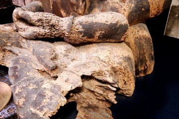 <p>The statue's right arm is missing, its left arm is broken, and both legs are half missing as well, but he still sits silently...for more than 1,000 years! &nbsp;</p>