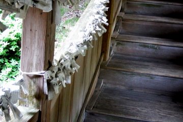 <p>Pieces of fortune telling paper are tied to every available places imaginable</p>