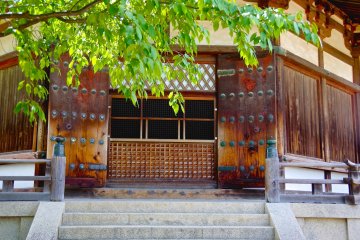 <p>Darkness behind the heavy doors of Yume-dono Hall</p>