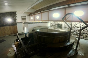 <p>A barrel onsen inside the hotel</p>